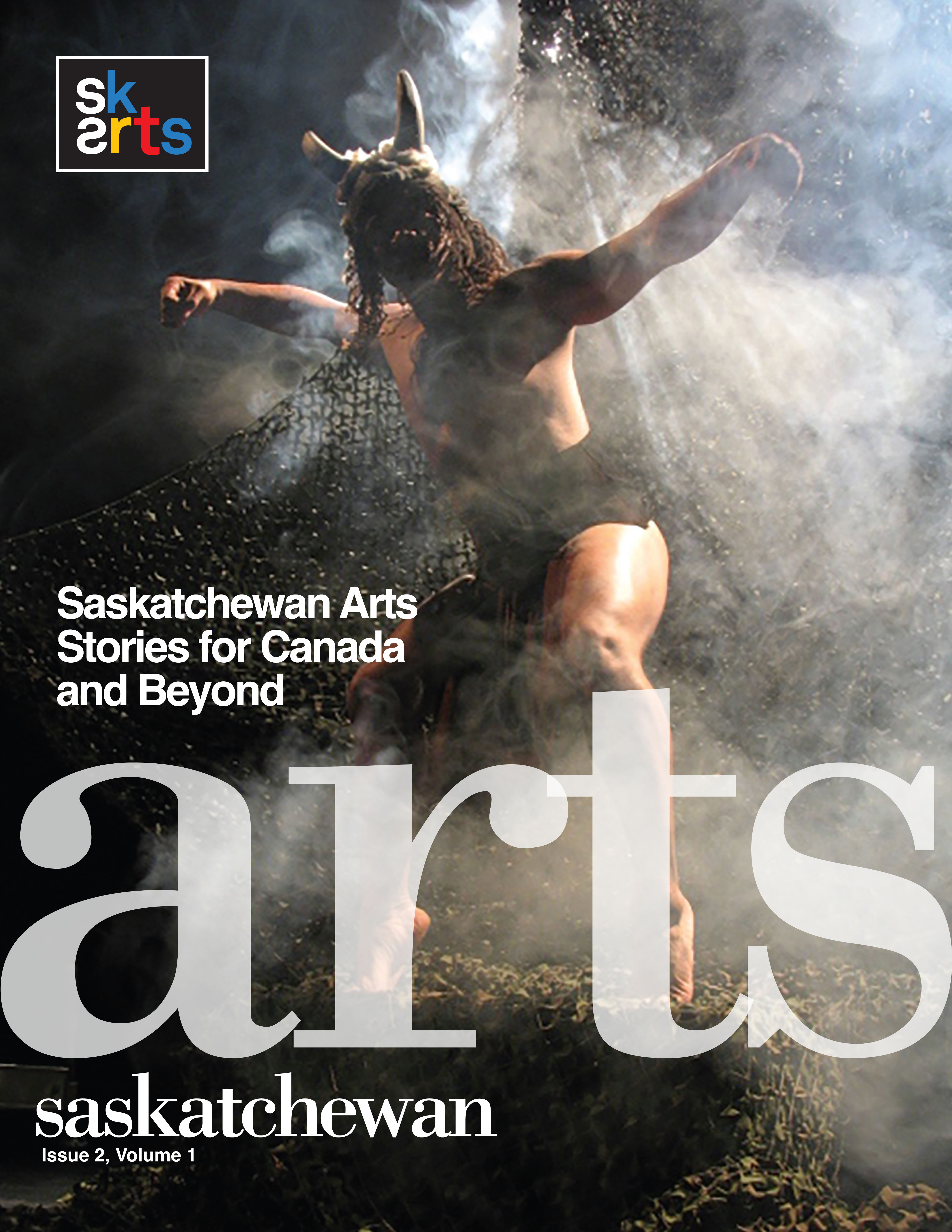 SK Arts' arts magazine ARTS Saskatchewan 2025 cover photo is of interdisciplinary artist Chancz Perry in performance with a mask, horns and net in a smoky environment. The photo was shot by photographer William Hales.