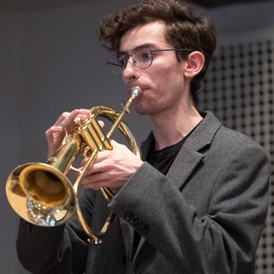 Graeme Dyck - Young man playing a wind instrument.