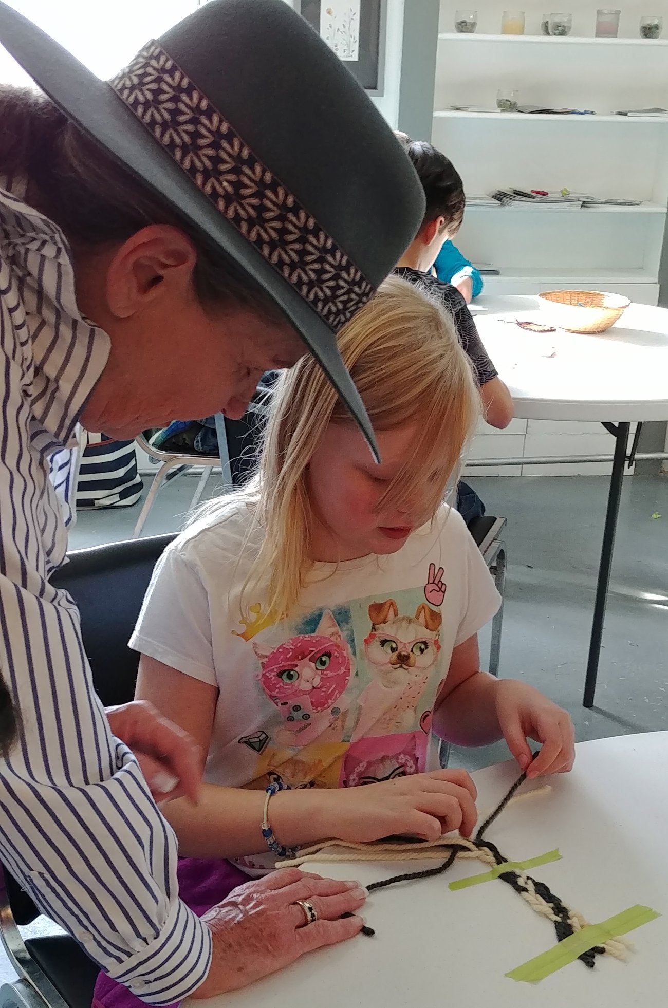 SKArts - Métis volunteer Darleen Peters from the Miywasin Centre demonstrated and taught Sidney Street School students the art of finger weaving (sash making).