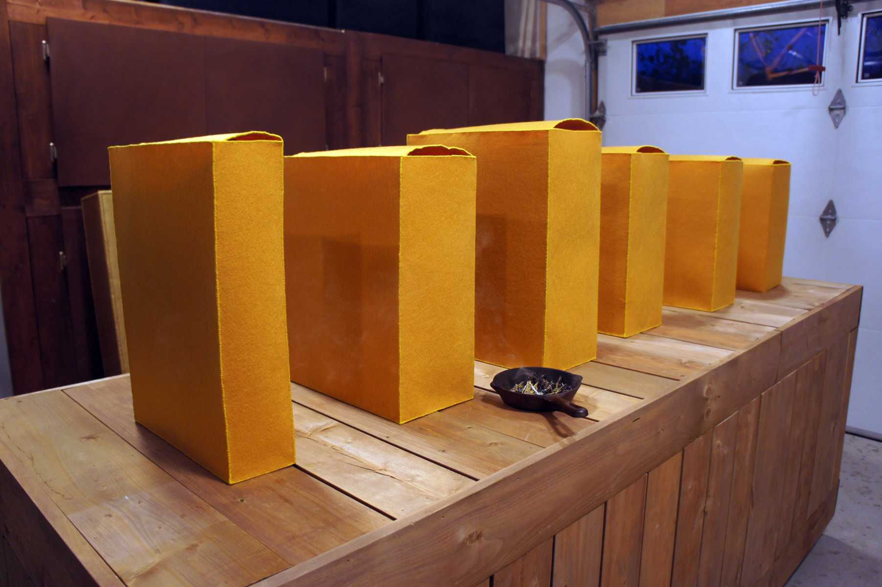 Golden-coloured boxes lined up in a row.