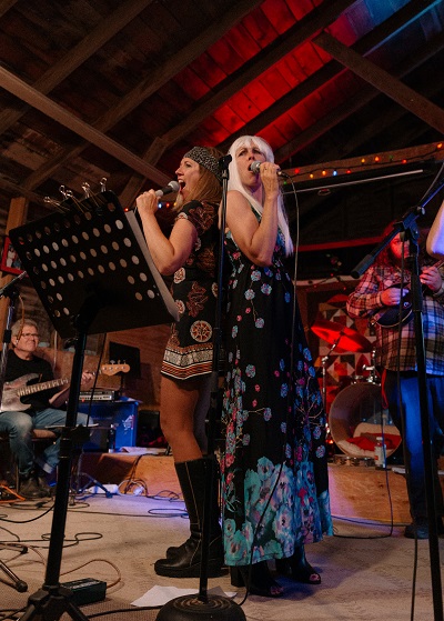 Annette and Michelle Campagne performing as ABBA at the Cheesy Song Social