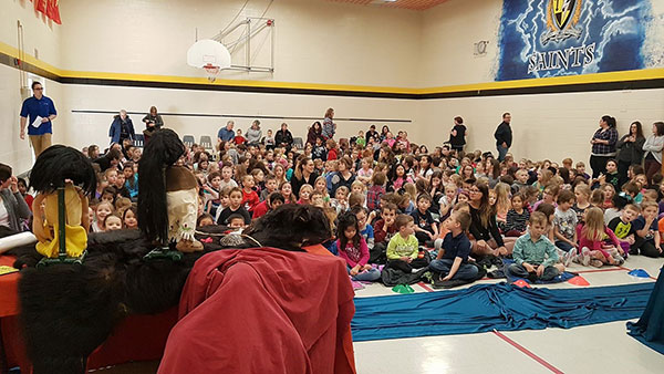 Rabbit and Bear Paws perform at a school in Unity