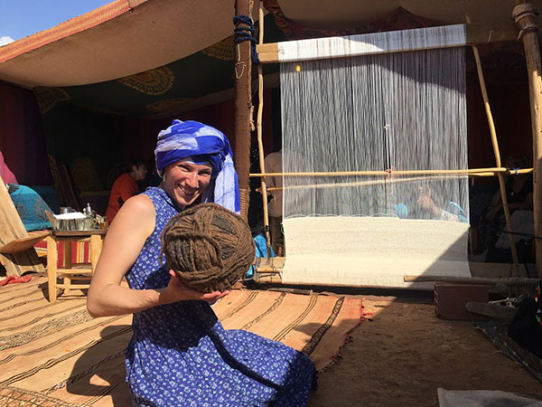 Cynthia Blanchette holds a ball of wool used by Moroccan women to weave the roofing for tents