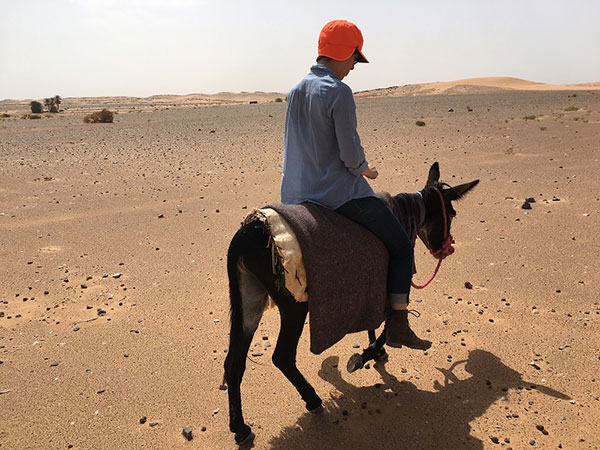 Blanchette takes a donkey riding lesson in Morocco
