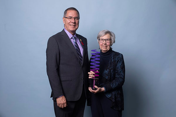 Martha Cole accepting her award from His Honour the Honourable Russ Mirasty, Lieutenant Governor of Saskatchewan