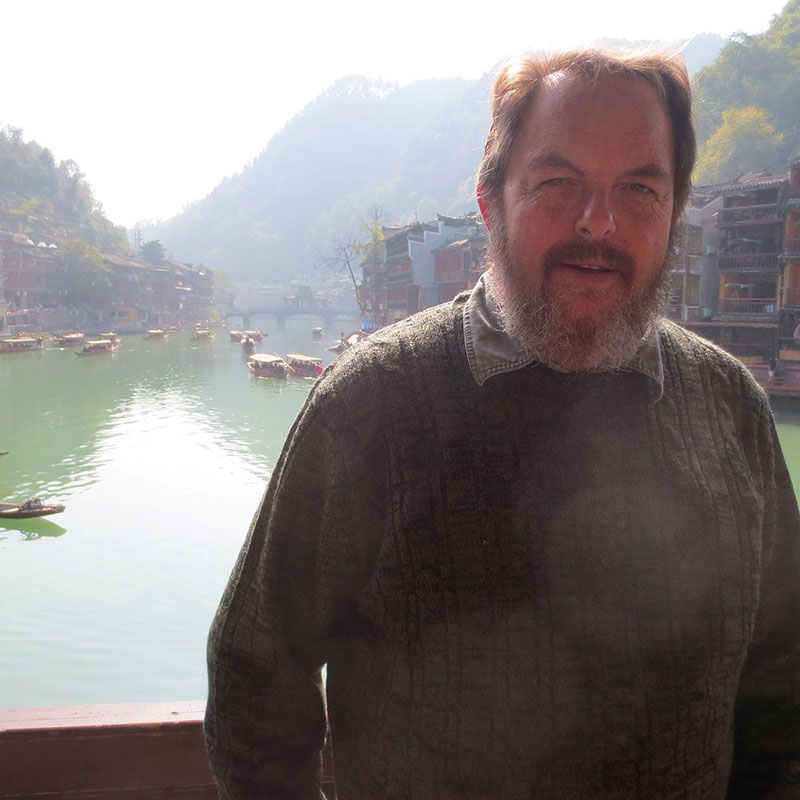 Kim Houghtaling - Older white man standing in front of lake