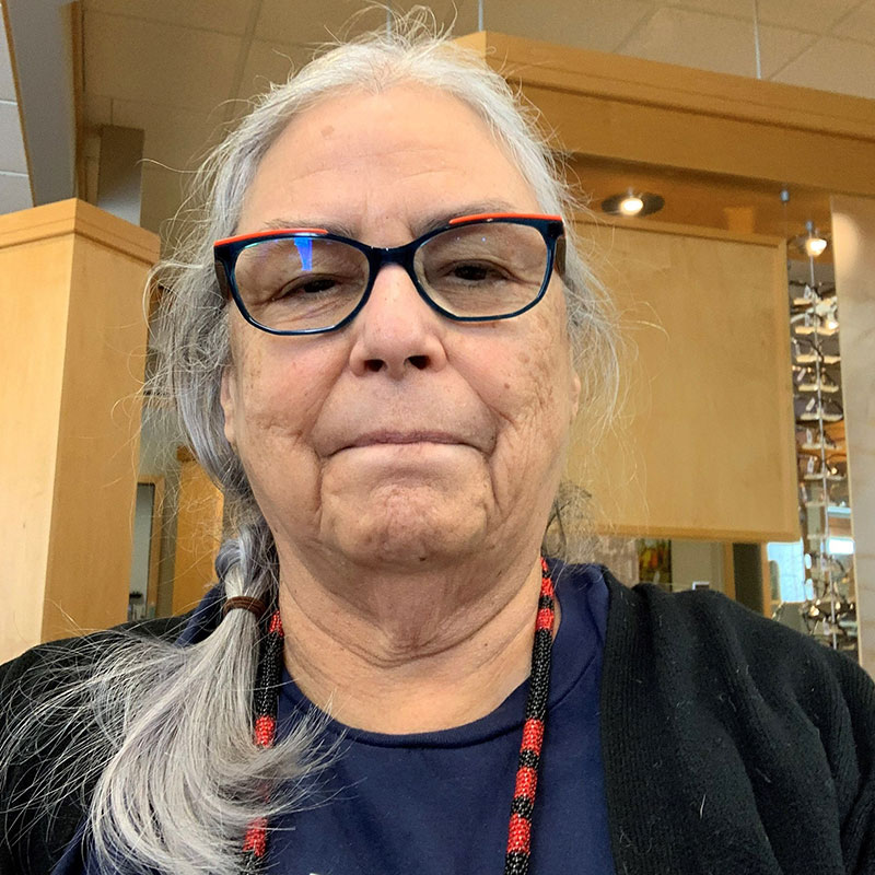Ruth Cuthand - Indigenous woman wearing glasses and gray hair
