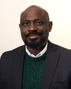Portrait of black bald man. Writer Michael Afenia